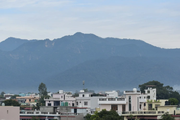 a view of a city with mountains in the background